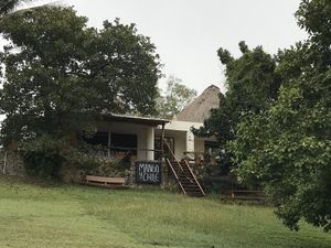 The front facing the road and lake at Mango y Chile in Bacalar
