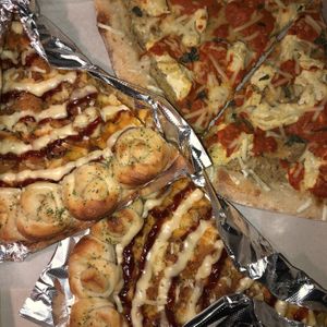 Garlic knot crust pizza ( Mac n cheese , fries , cauliflower) and Eggplant Rollatini  at That Pizza Place in Levittown