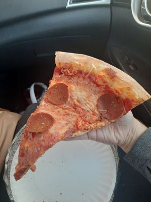 A slice of pizza with vegan cheese + pepperoni! at That Pizza Place in Levittown