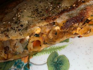  Better look inside. Onions and lots of vegan cheese too  at That Pizza Place in Levittown