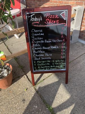 Vegan specials are labeled with a V and in green at That Pizza Place in Levittown