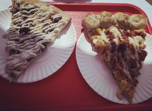 “Meat lovers” Ranch sauce slice and Loaded slice (Cauliflower, Mac and Cheese, Fries, BBQ, Ranch, Buffalo slice with Garlic Knot crust at That Pizza Place in Levittown