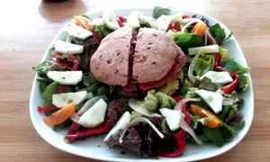 Quinoa and beetroot burger with home made integral spelt bun and green leaves salad (macerated vegetables, spinach, acelga, etc) at Veg Art Natural Food in La Palma