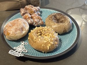 Jelly, French toast, coffee donuts, peach fritter   at Mighty-O Donuts - Ballard in Seattle