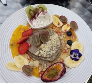 Buckwheat pancakes with Cocowhip and maple syrup and fruit.  at Mr Black Juicery in Berwick