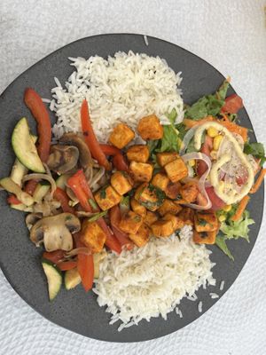 Portuguese style tofu, sautéed vegetables, rice and salad  at Ateliê 47 in Silves