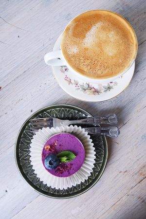 Raw blueberry cake with an oat flat white at Paradise Plantbased in North West London