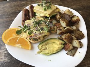 Tofu Benedict with sausage and avocado  at Grow Your Roots Cafe in Ottawa