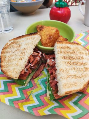 Bacon sandwich with hash browns at Pico Lounge in Glossop