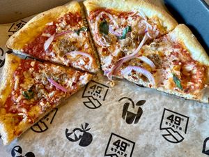 Half eaten spicy sausage pizza - YUM!  at 49th State Brewing Co in Anchorage