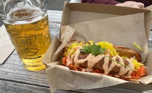 Vegan Bahn Mi with Alaska cider. We left the jalapeño off. Had a very mild heat. Sausage was really good and paired well with the sweetness of the aioli and vegetables. Recommende at 49th State Brewing Co in Anchorage