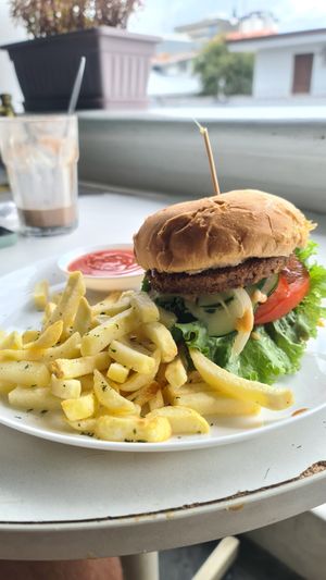 Double BBQ Burger with fries at De Aca in San Jose