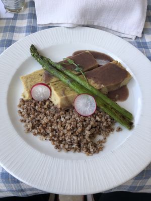 chickpea cakes in wine sauce with buckwheat and asparagus  at VeganFresh Hotel & Restaurant in Medvode