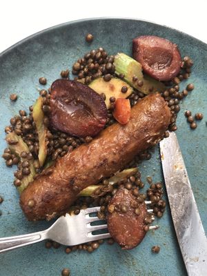 grilled beyond sausage with beluga, plums and veggies at Vegan Kiosk in Bratislava