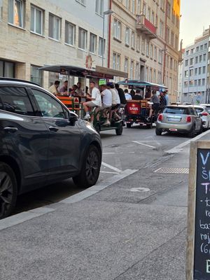 Passing beer bikes at Vegan Kiosk in Bratislava