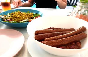 Vegan sausages, baked beans in tomato sauce. at Vegan Kiosk in Bratislava