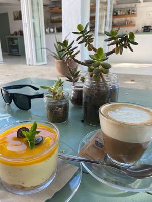 Delicious gluten-free cheesecake with soy milk coffee at Aubergine in Ibiza