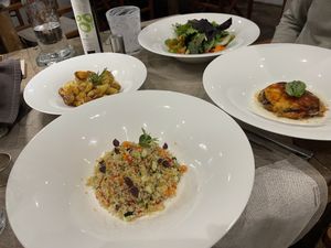 Main courses with two of the side dishes: potatoes and salad  at Mamabeach in Olbia