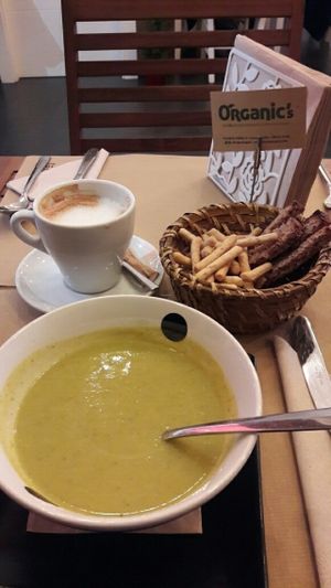Vegetable cream soup. Soy milk latte. bread basket tapas at Organic's in Sevilla