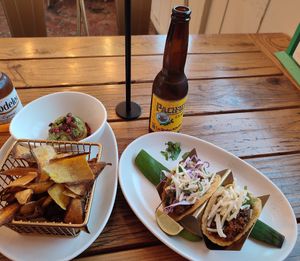 Cali & Baja tacos with vegan picadillo, side order of plantain chips with guac at Tocaya Modern Mexican in Venice