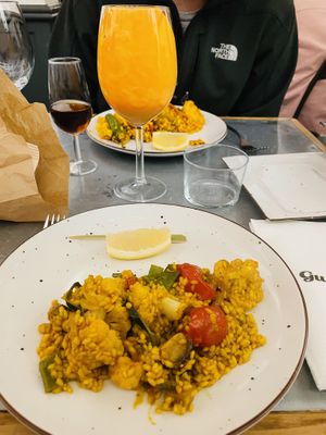 Paella is served tableside for you   at Gusto Ristobar in Sevilla