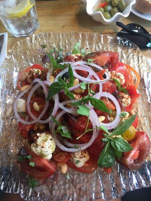 Tomato salad with vegan ricotta cheese at Gusto Ristobar in Sevilla