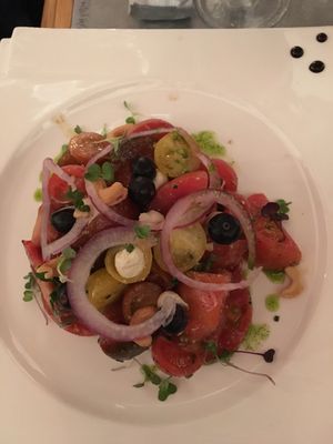 Tomato salad and a few little spots of vegan ricotta cheese at Gusto Ristobar in Sevilla