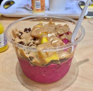 Pink Panther Pitaya Bowl 💗🌸🌺 Made with a base of pitaya, banana, mango, lime, coconut yoghurt. Topped with banana, mango, strawberries, raw press 'grawnola', coconut flake at Raw Press in South West London