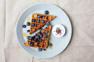 Blueberry & Maple Waffle served with fresh blueberries and coconut yoghurt  at Raw Press in South West London