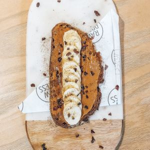 banana, peanut butter, cinnamon and cacao nibs, on sourdough toast. at Raw Press in South West London