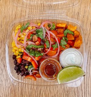 Mexican Salad.
With sweet potato, black beans, sweetcorn, cherry tomato, red pepper, pickled onions and crispy shallots, with a cashew 'sour cream' and a spicy sriracha dressing. at Raw Press in South West London