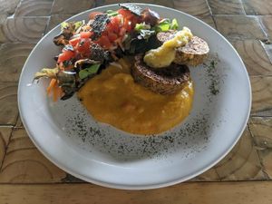 Menu del dia. Delicious salad, patties, and polenta. at Tandana in Quito