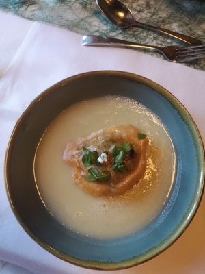 Petersilienwurzelsuppe mit Pilzravioli at Wohlfuhlhotel Goiserer Muhle in Bad Goisern