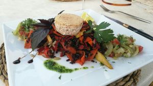 Fried black rice, red pepper and carrot with celeriac salad and almond feta cheese.  at Restaurant Quay in Mallorca