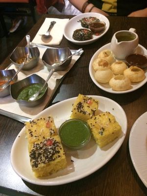 A selection of chutneys/sauces.
Patra (top).
Pani Puri (middle).
Dhokla (bottom). at Sanskruti Restaurant in Liverpool