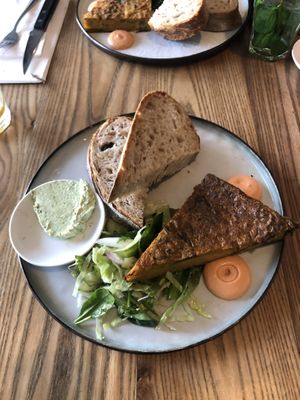 Frittata from potatoes and spinach, salad, herb butter, and mayo from sun-dried tomatoes    at BROEI in Utrecht
