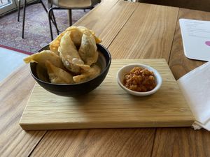 Fried dumplings: quite good. It contains only veggies and has a mild flavour. The dip contains ginger and baked onion (I think)  at BROEI in Utrecht