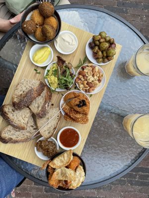 Vegan breakfast for two (it was enough for three) with kombucha on the terrace. Soooo good!  at BROEI in Utrecht