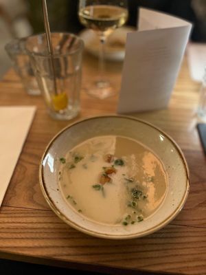 Salsify soup: A nice thick soup made from an uncommon (forgotten) vegetable with pickled cucumber and chives.  at BROEI in Utrecht