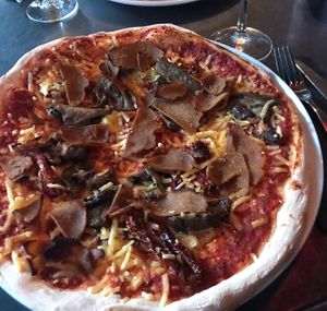 Vegan cheese, Seitan flakes, grilled eggplant and sundried tomatoes   at Pizzeria Napoli in Tampere