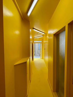 Yellow sunshine corridor at The Canvas at The Canvas: Shoreditch in East London