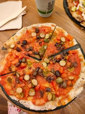 Pizza with vegan anchovies, olives and tiny cucumbers at #RAW VEGAN FIRENZE in Florence