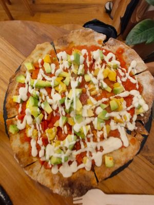 Pizza with avocado and vegan cheese on it from cashew at #RAW VEGAN FIRENZE in Florence