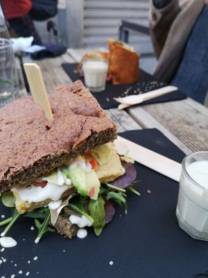 Focaccia rossa con Cecina, avocado, spinacino, vegan cheese e pomodori at #RAW VEGAN FIRENZE in Florence