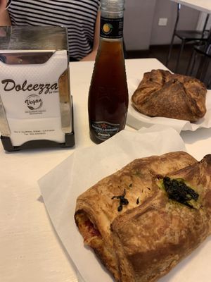 Savoury “croissant” with spinach, tomato and vegan cheese and the other with onions, tomato and vegan cheese    at Bar Dolcezza in Catania