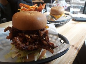Brick Lane Bhaji burger with a Pulled mooshie and sweet potato cheesy fries at Mooshies in East London