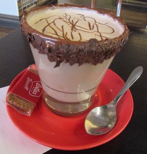 VELVETY VEGAN - Vegan milk chocolate melted and frothed with Bonsoy, topped with vegan chocolate drizzle and choc shavings. at San Churro in Wantirna South