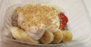 Chia pudding with fresh  cut strawberries and bananas, topped with dairy-free, coconut whipped cream and crushed walnuts. at True Earth Juicery & Vegan Cafe in North Hollywood