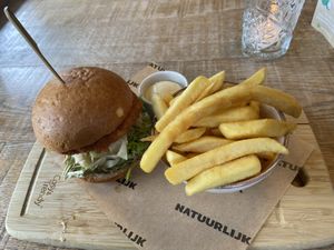 Vegan burger: the patty is a bit like a flat and round kroket with celleriac. It’s tasty and a bit sweet. The fries are very good as well. at Natuurlijk in Egmond Aan Zee