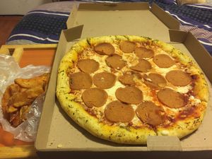 Pepperoni pizza and fries  at Veggino's Pizza in Mexico City